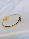 Pulsera rígida en acero dorado