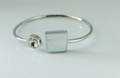 Pulsera rígida en acero quirúrgico, brillo y nácar